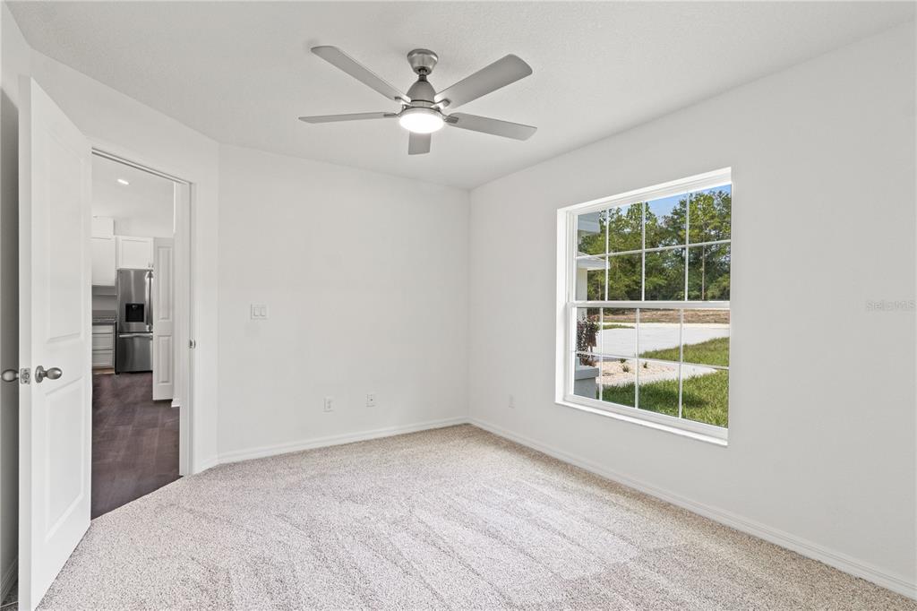 15333 Honeycreeper Road Brooksville, FL 34614 - Photo 14 of 19 an empty room with windows and closet