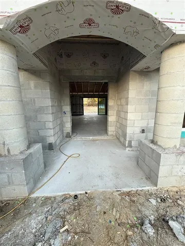 a view of a wooden door of the house