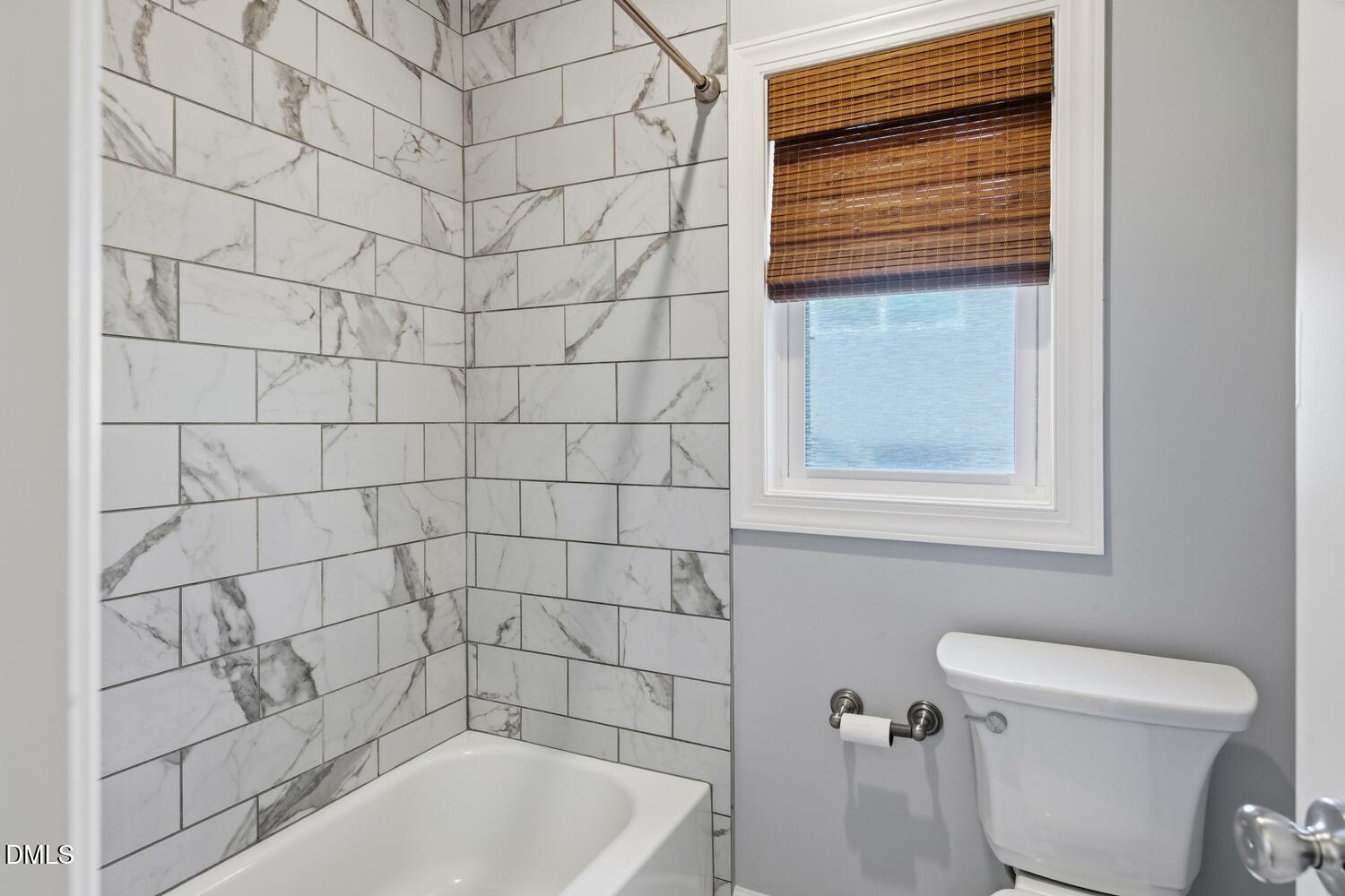 217 Moline Street Durham, NC 27707 - Photo 10 of 30 a bathroom with a bathtub and toilet