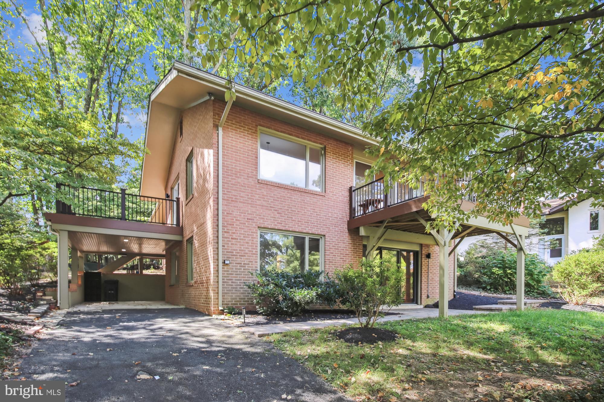 11221 South Shore Road Reston, VA 20190 - Photo 1 of 61 a front view of a house with a yard
