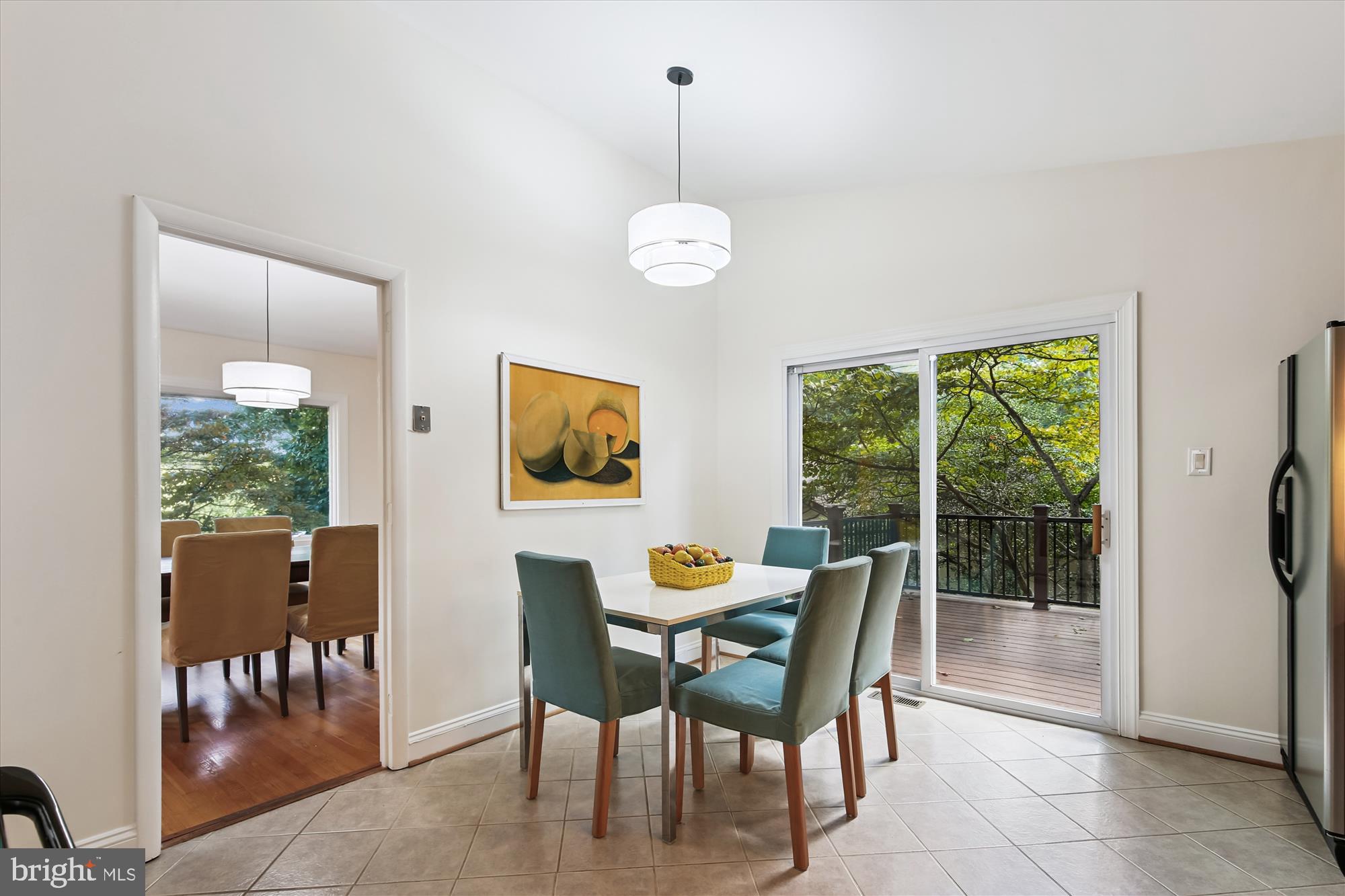 11221 South Shore Road Reston, VA 20190 - Photo 15 of 61 a dining room with furniture a chandelier and window