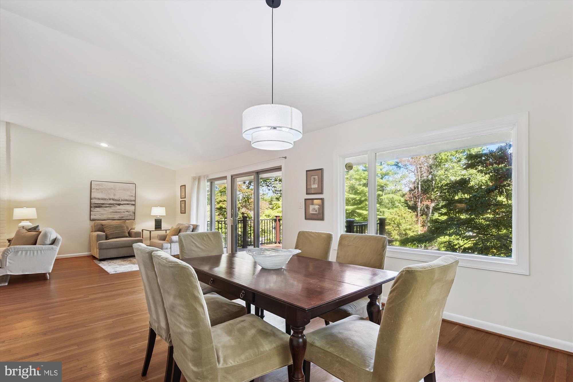 11221 South Shore Road Reston, VA 20190 - Photo 21 of 61 a view of a dining room with furniture window and wooden floor