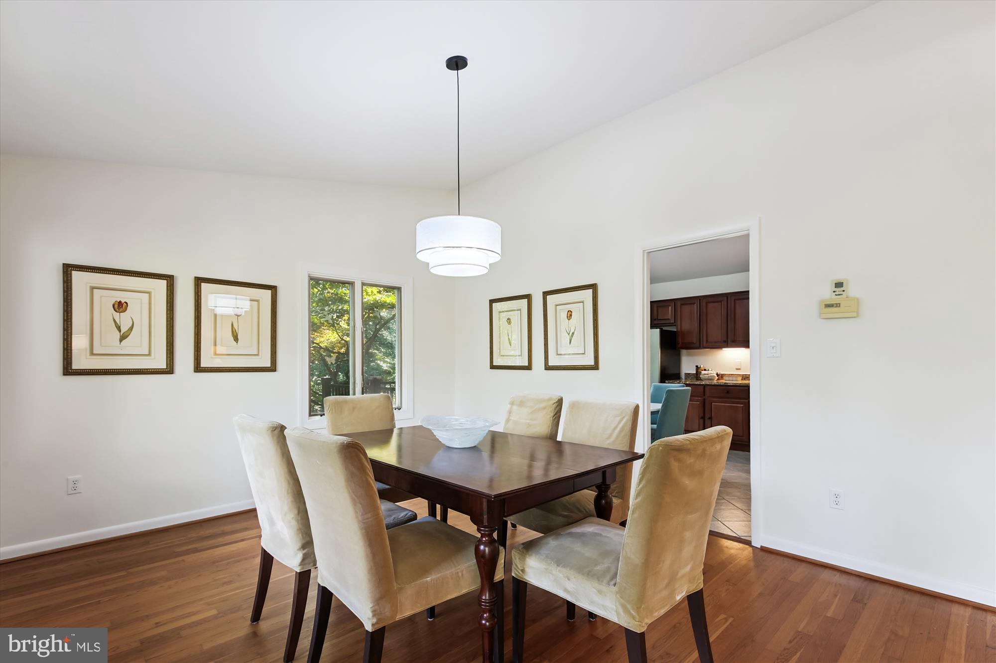 11221 South Shore Road Reston, VA 20190 - Photo 24 of 61 a view of a dining room with furniture window and wooden floor