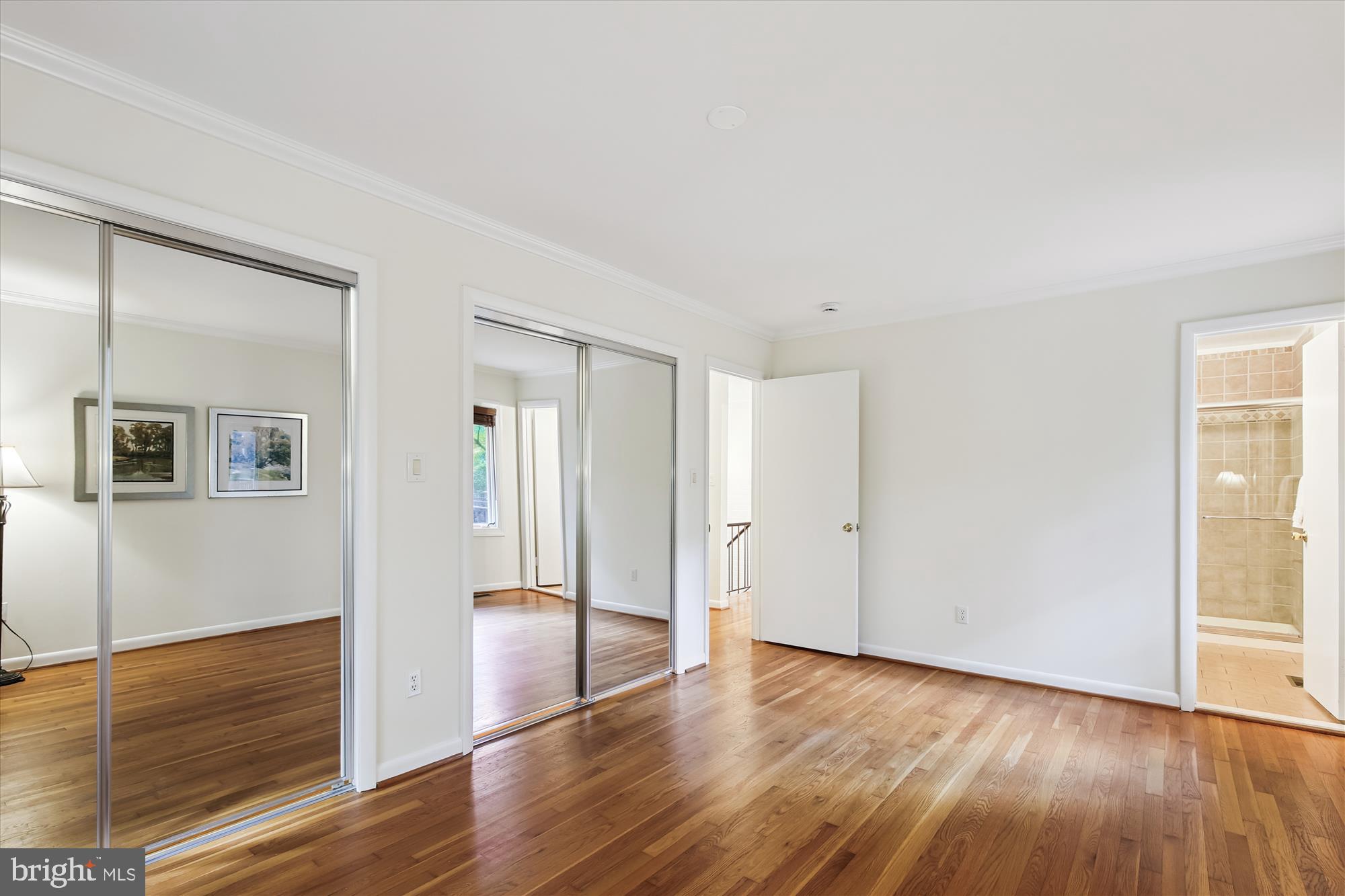 11221 South Shore Road Reston, VA 20190 - Photo 28 of 61 a view of an empty room with wooden floor and a window