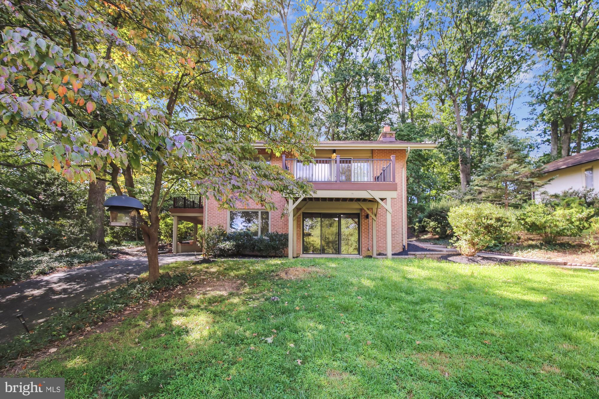 11221 South Shore Road Reston, VA 20190 - Photo 3 of 61 a large building with trees in front of it