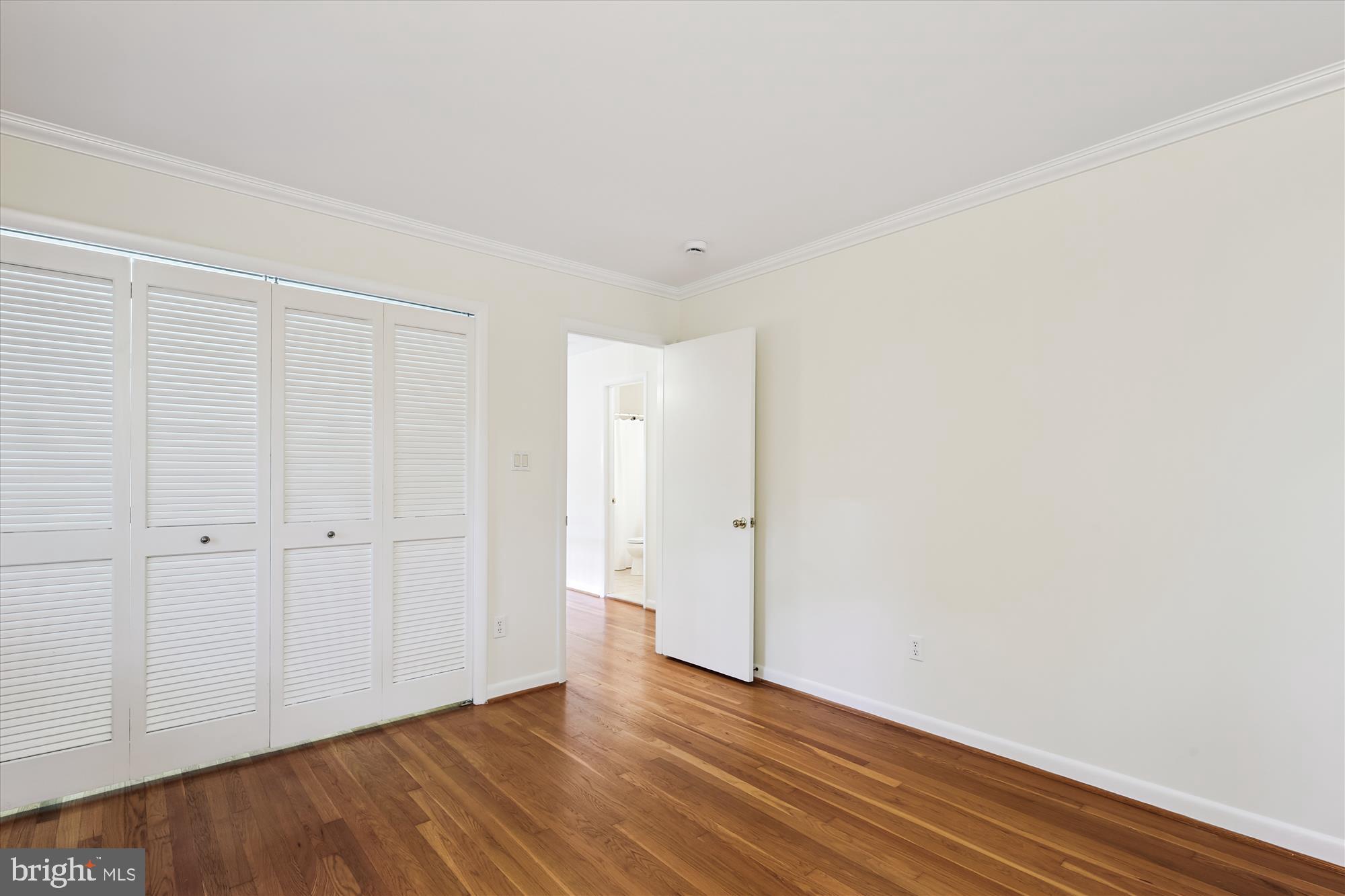 11221 South Shore Road Reston, VA 20190 - Photo 32 of 61 a view of an empty room with wooden floor
