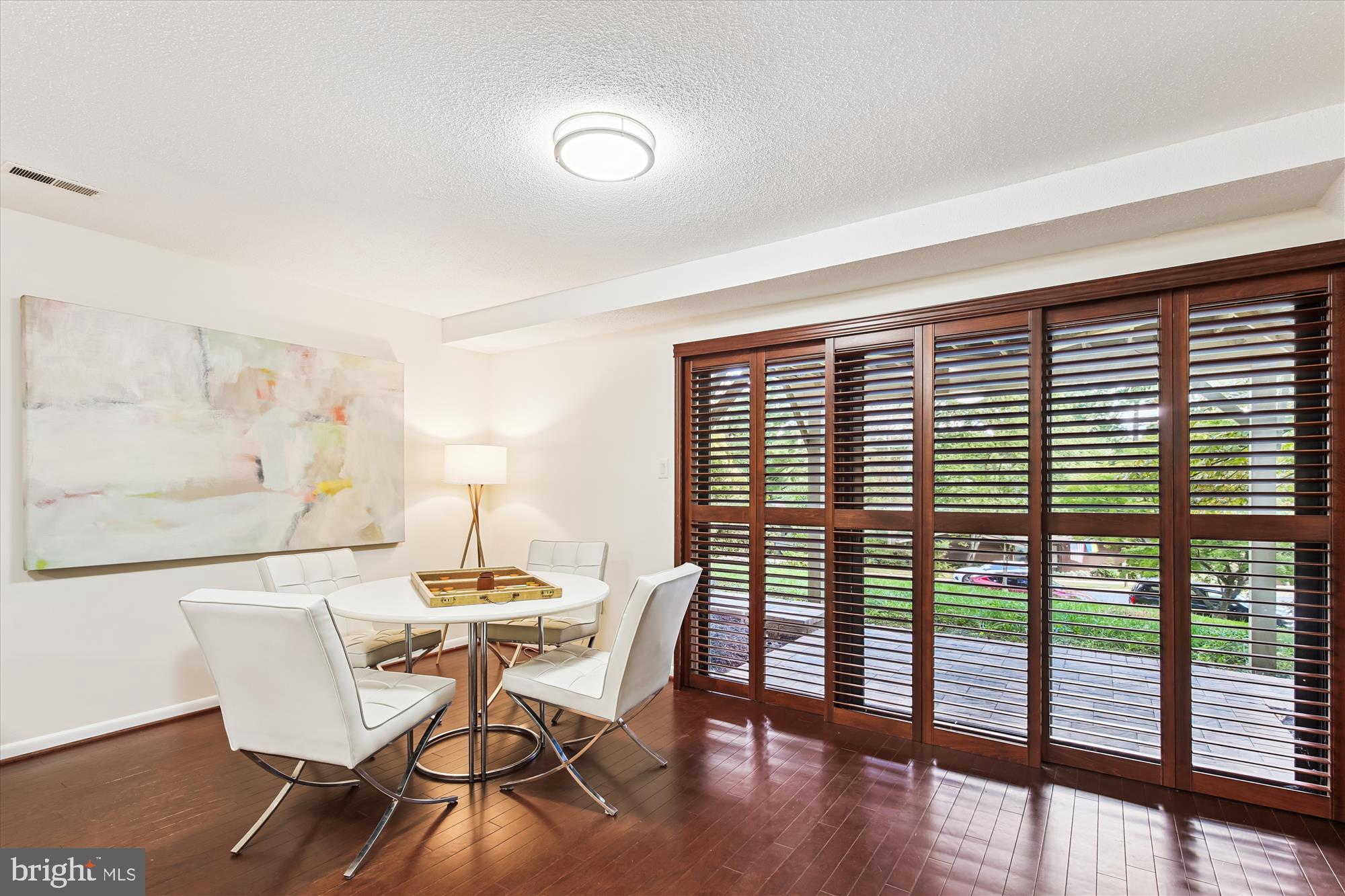 11221 South Shore Road Reston, VA 20190 - Photo 49 of 61 a dining room with furniture and wooden floor