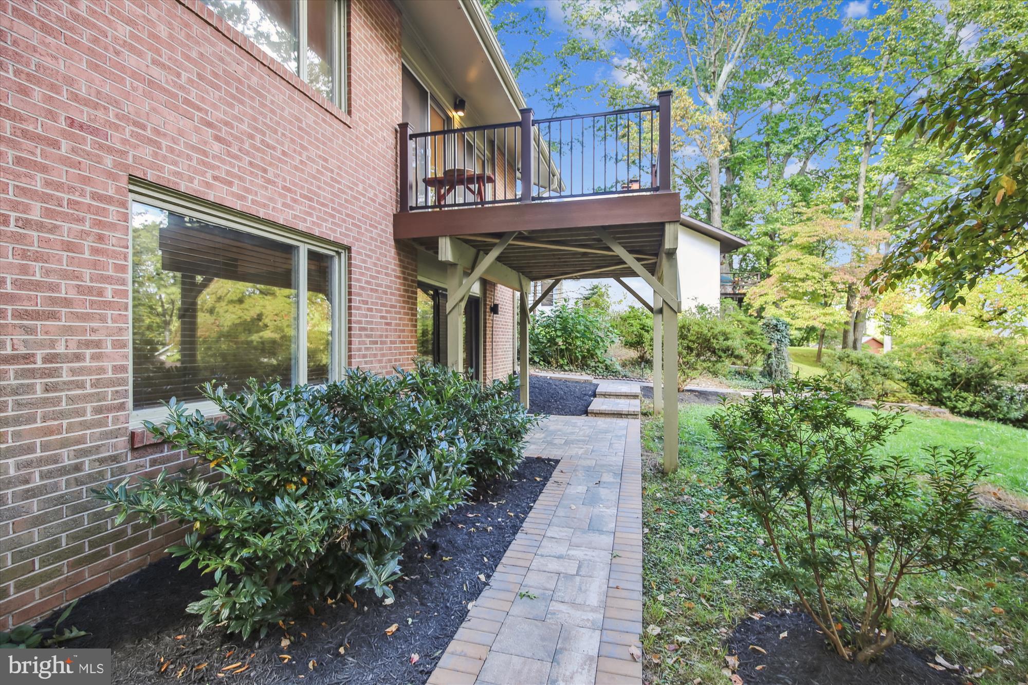 11221 South Shore Road Reston, VA 20190 - Photo 5 of 61 a view of a pathway of a house with potted plants