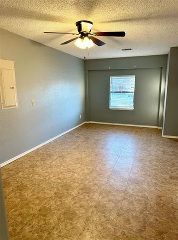 a view of a big room with closet and chandelier fan