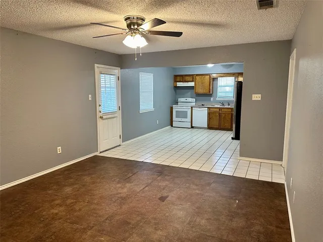 a kitchen with a sink cabinets and window