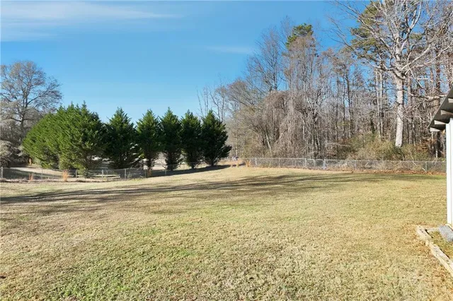 a view of a swimming pool with an outdoor space and seating area