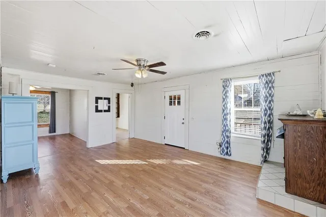 a view of livingroom with hardwood floor and a ceiling fan