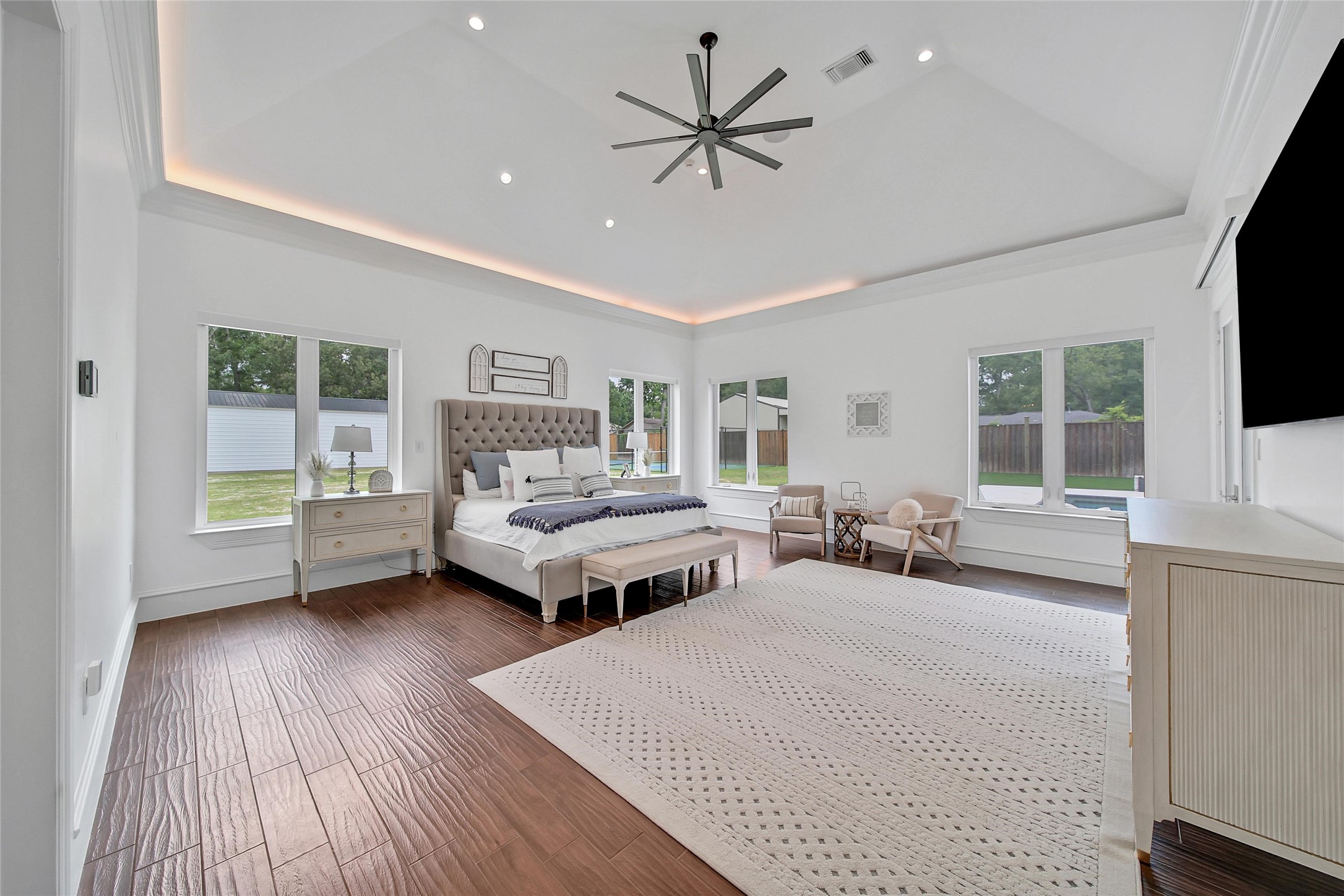 24357 East Webb Road Porter, TX 77365 - Photo 13 of 50 a bedroom with a bed window and a flat screen tv
