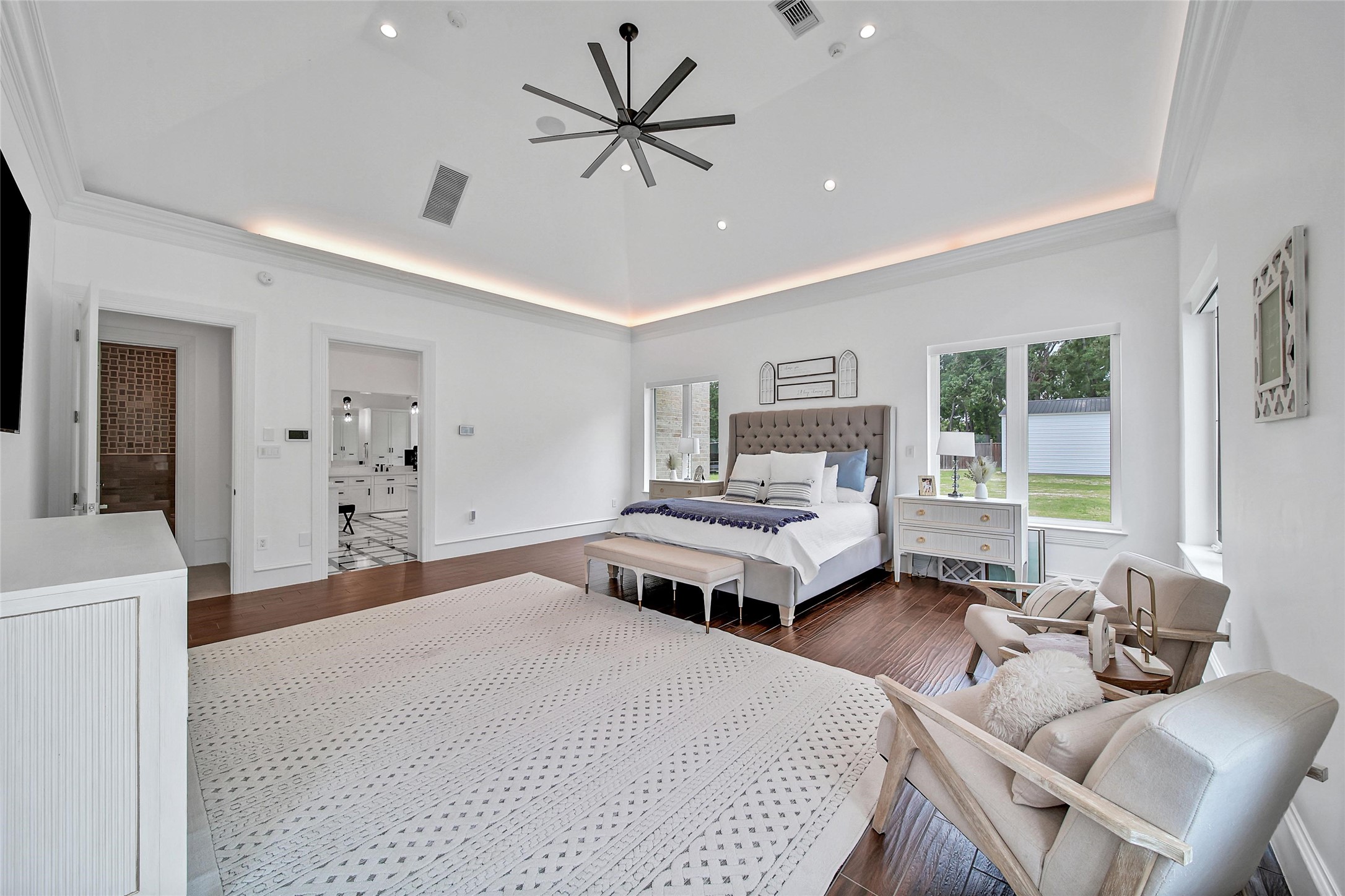 24357 East Webb Road Porter, TX 77365 - Photo 14 of 50 a bedroom with a bed and wooden floor