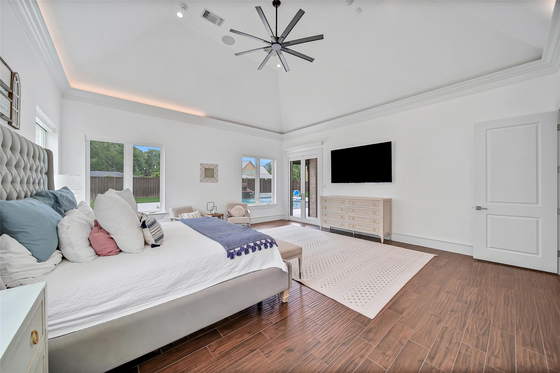 24357 East Webb Road Porter, TX 77365 - Photo 15 of 50 a bedroom with a bed window and a flat screen tv