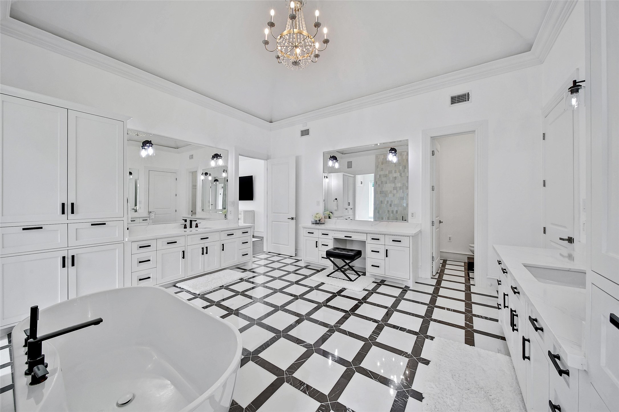 24357 East Webb Road Porter, TX 77365 - Photo 18 of 50 a large white bathroom with a sink mirror and shower