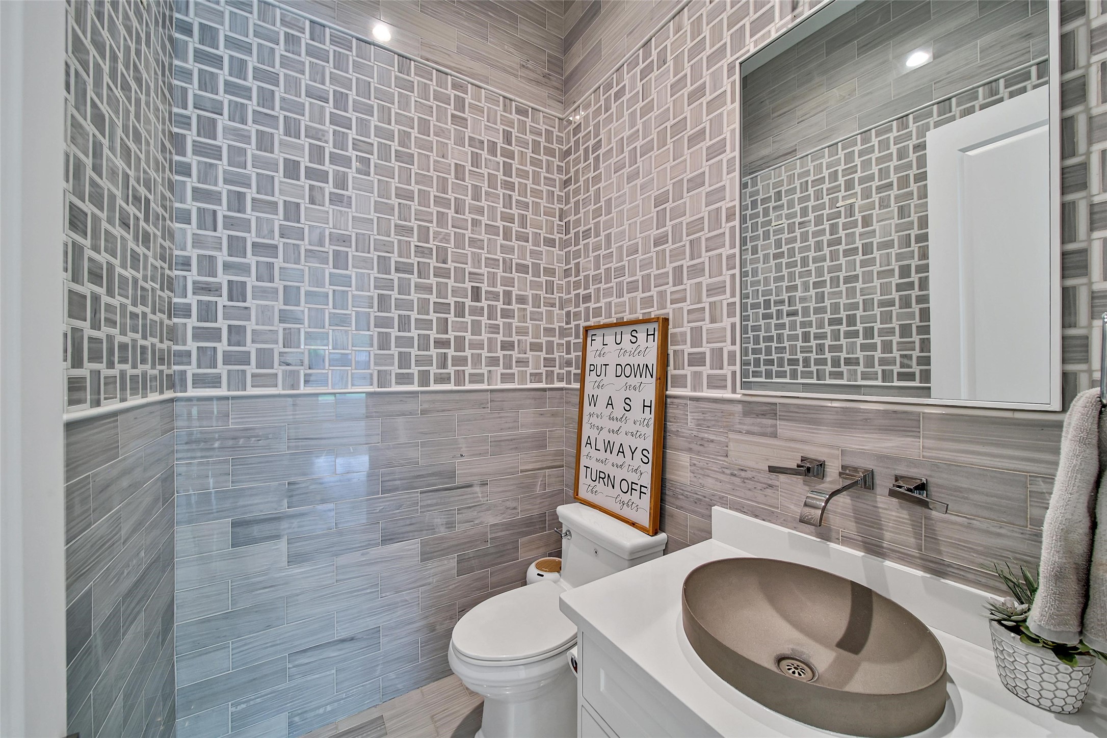 24357 East Webb Road Porter, TX 77365 - Photo 20 of 50 a bathroom with a toilet sink and mirror