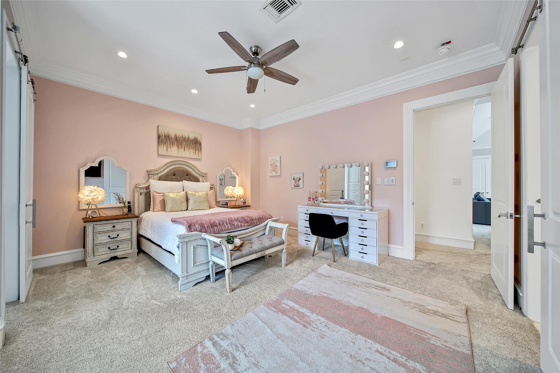 24357 East Webb Road Porter, TX 77365 - Photo 22 of 50 a bedroom with a bed and a chandelier