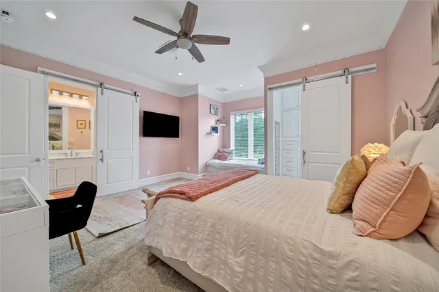 a bedroom with a bed window and couch