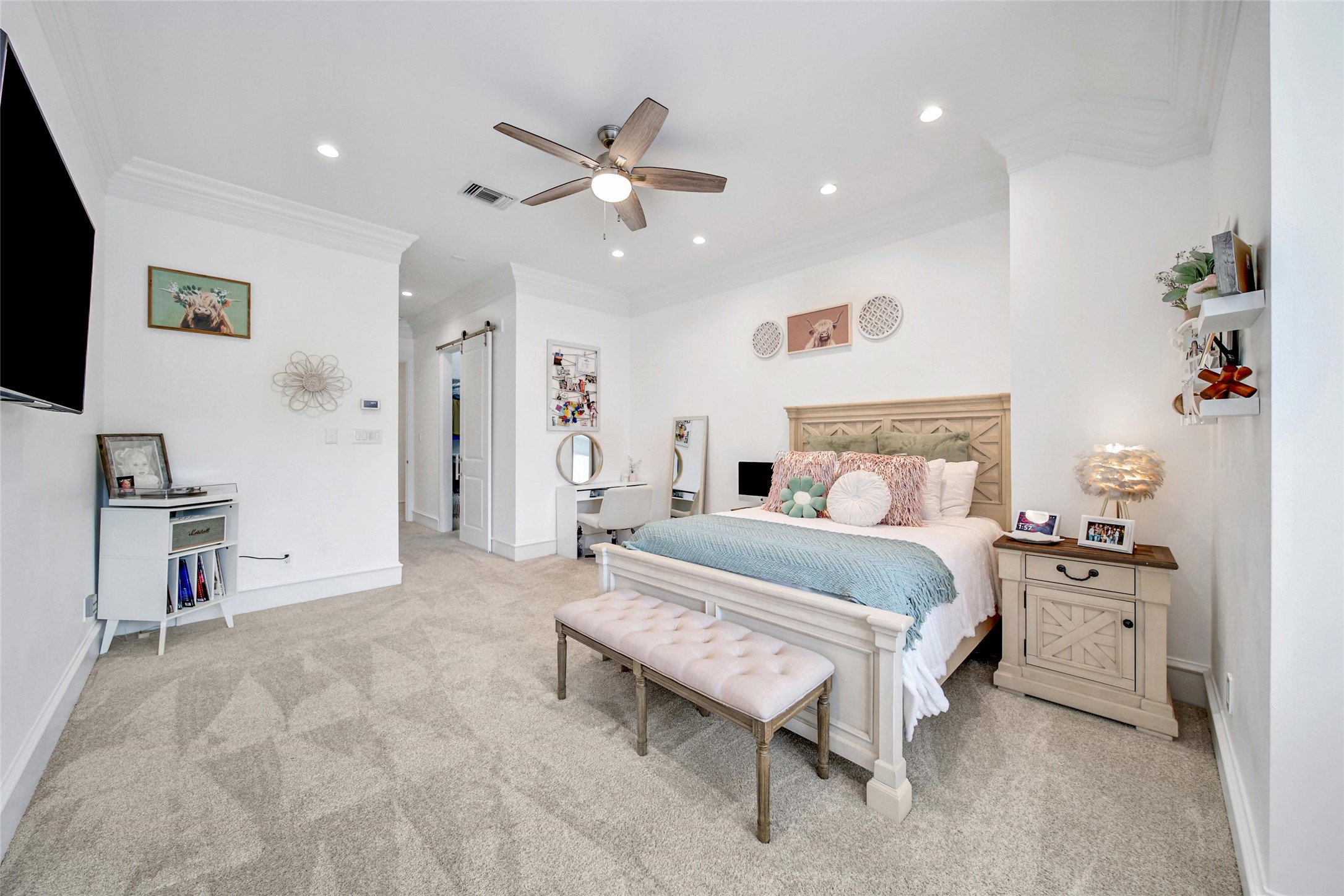 24357 East Webb Road Porter, TX 77365 - Photo 25 of 50 a bedroom with a bed and a chandelier