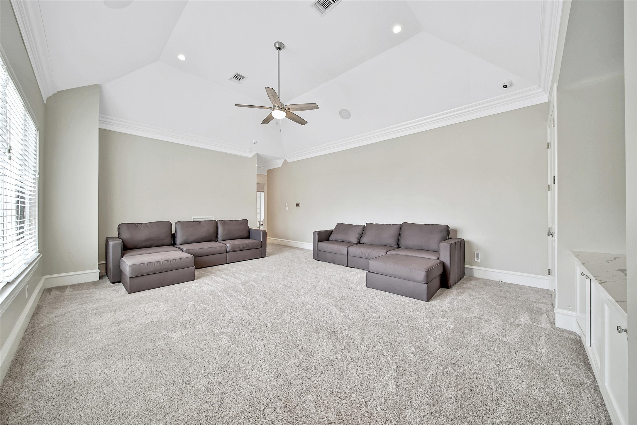 24357 East Webb Road Porter, TX 77365 - Photo 36 of 50 a living room with furniture and a ceiling fan