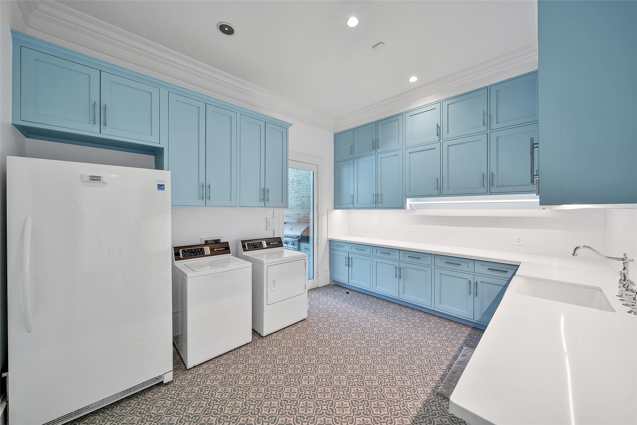 24357 East Webb Road Porter, TX 77365 - Photo 38 of 50 a kitchen with a stove a refrigerator and wooden cabinets