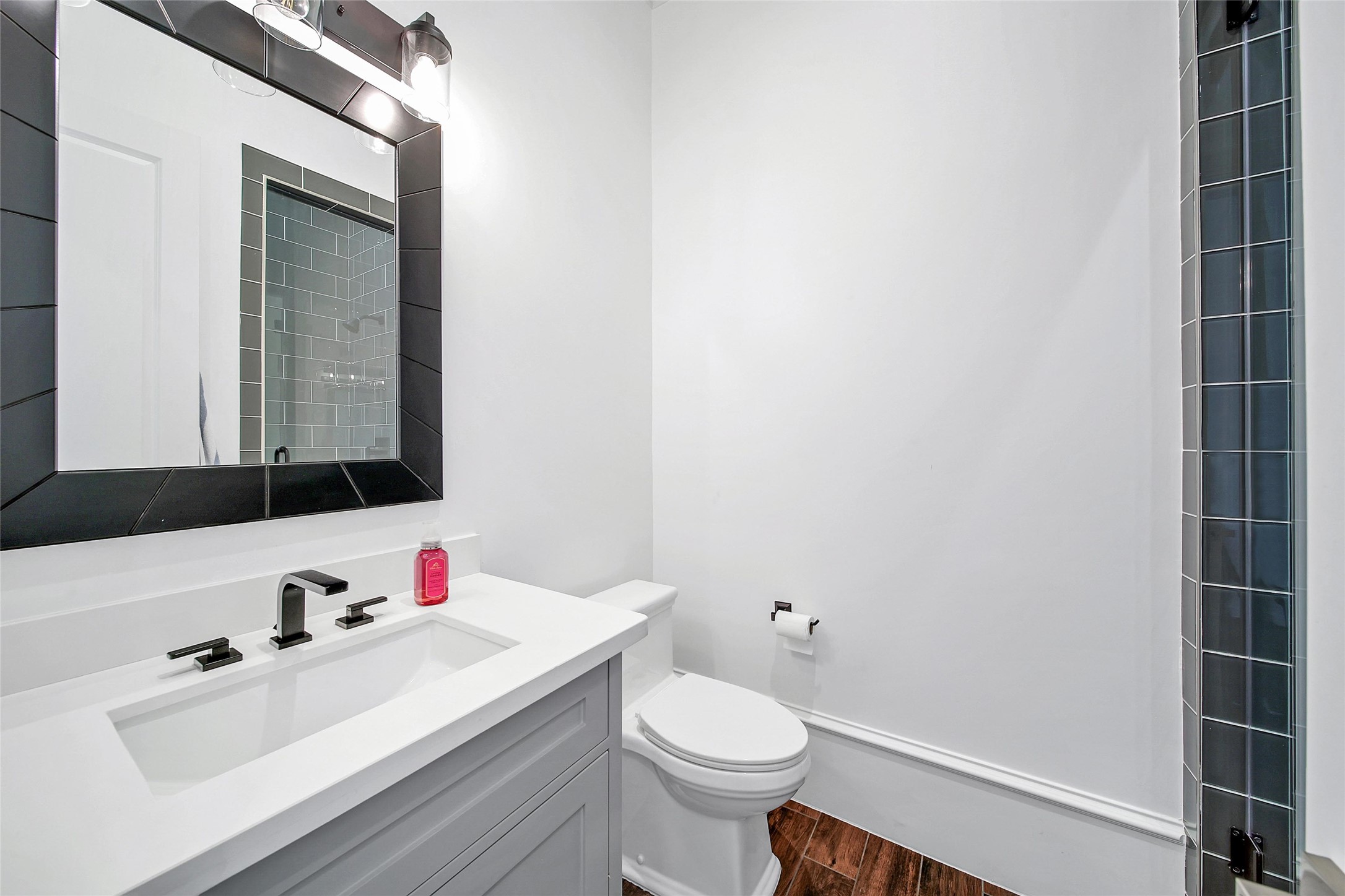 24357 East Webb Road Porter, TX 77365 - Photo 40 of 50 a bathroom with a sink vanity mirror and toilet