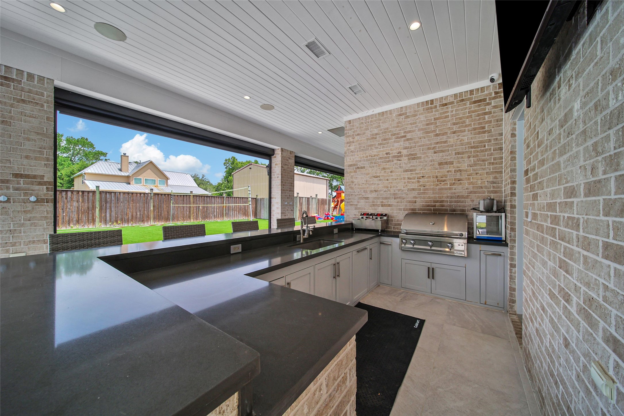 24357 East Webb Road Porter, TX 77365 - Photo 46 of 50 a kitchen with stainless steel appliances a stove sink and cabinets