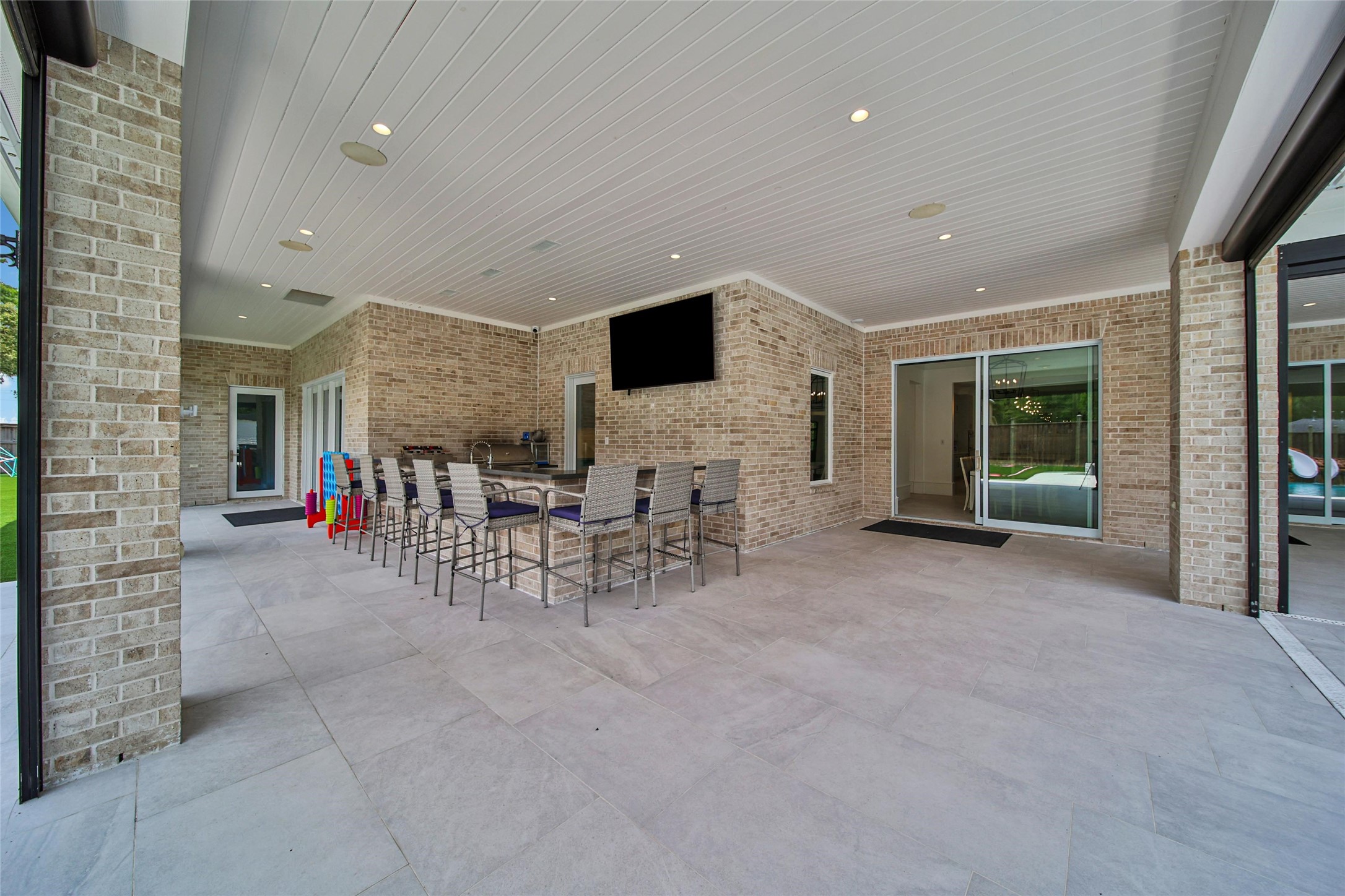 24357 East Webb Road Porter, TX 77365 - Photo 47 of 50 a living room with furniture and a flat screen tv