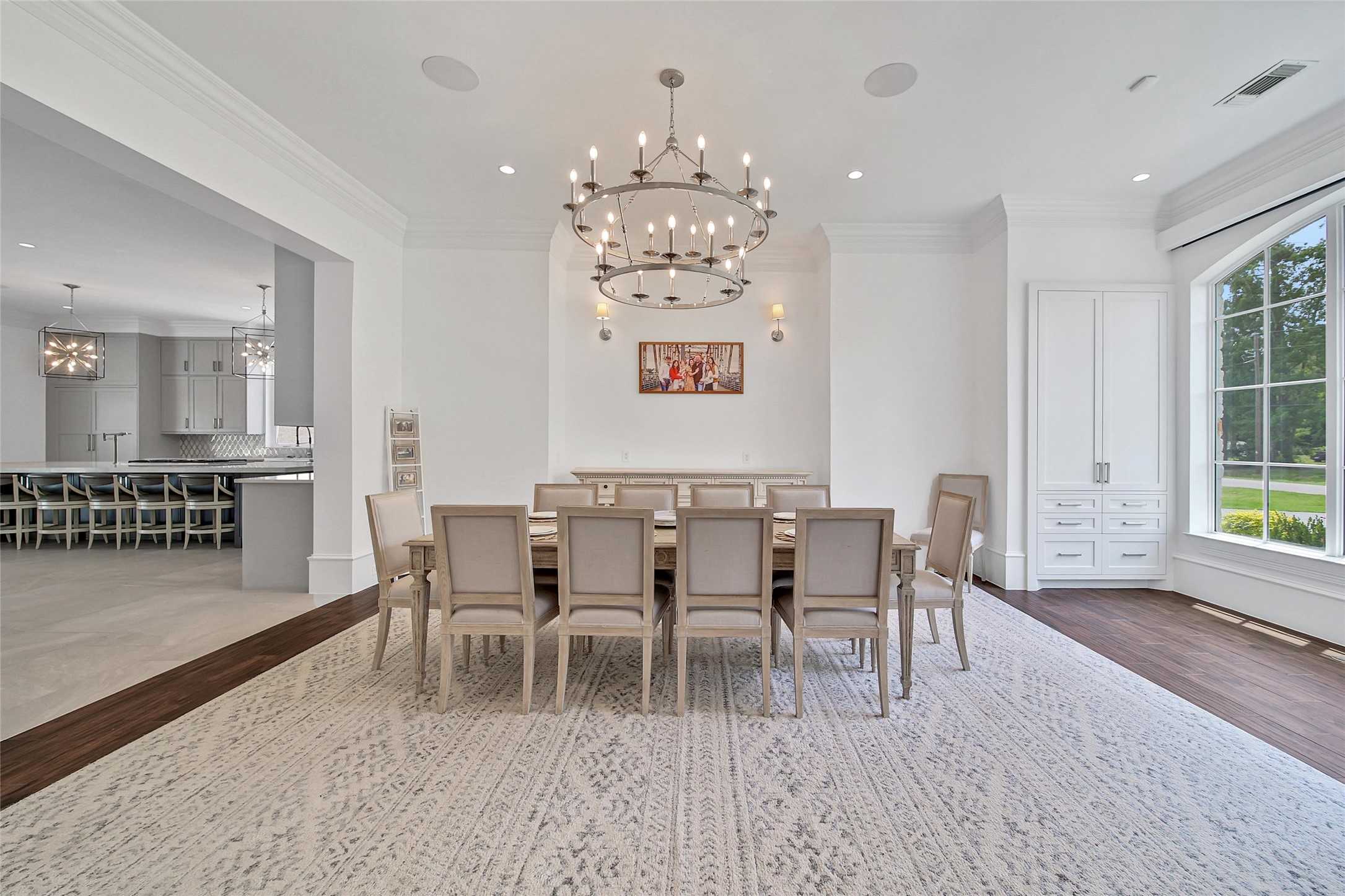 24357 East Webb Road Porter, TX 77365 - Photo 5 of 50 a dining room with furniture a chandelier and wooden floor