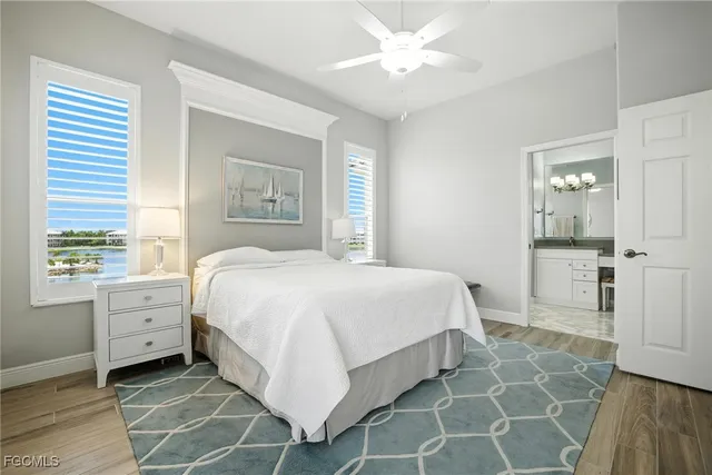 a spacious bedroom with a bed and a window