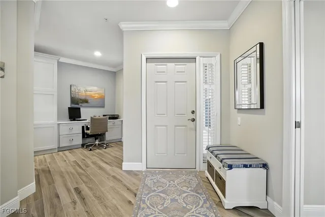 a hallway with a bed and furniture