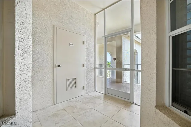 a bathroom with a glass shower door and a glass door