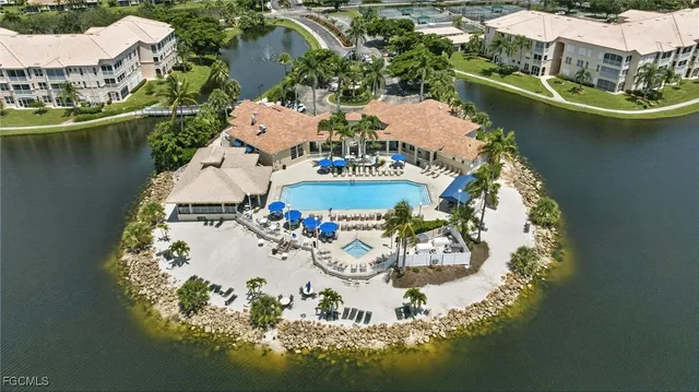 an aerial view of a house with a lake view