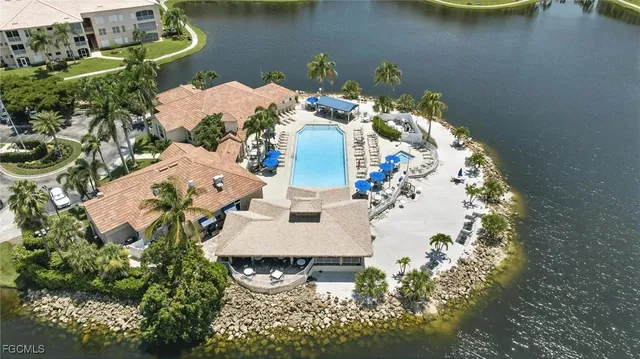 an aerial view of a house with swimming pool and outdoor space