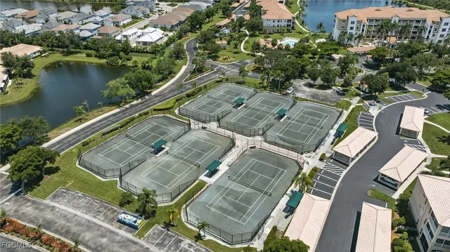 an aerial view of a house with outdoor space and lake view