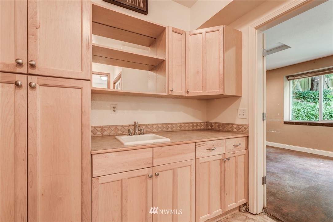 2633 189th Street Southeast Bothell, WA 98012 - Photo 12 of 35 a kitchen with stainless steel appliances granite countertop a sink and a cabinets