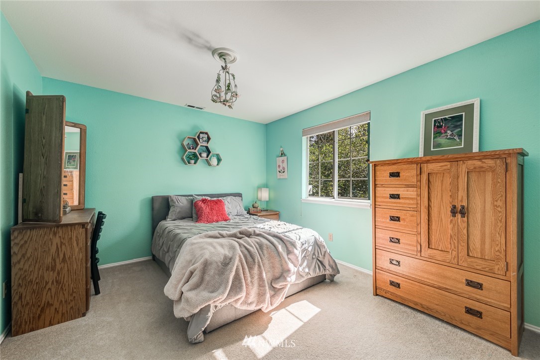 2633 189th Street Southeast Bothell, WA 98012 - Photo 20 of 35 a bedroom with a dresser and window
