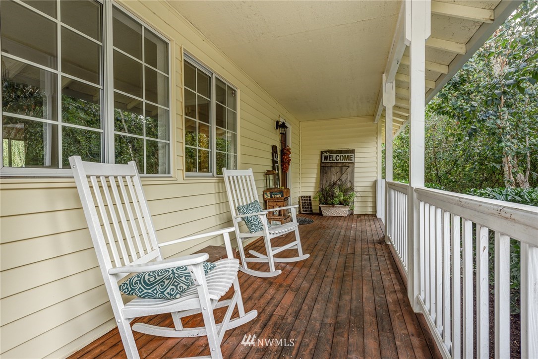 2633 189th Street Southeast Bothell, WA 98012 - Photo 3 of 35 a view of balcony with wooden floor and fence