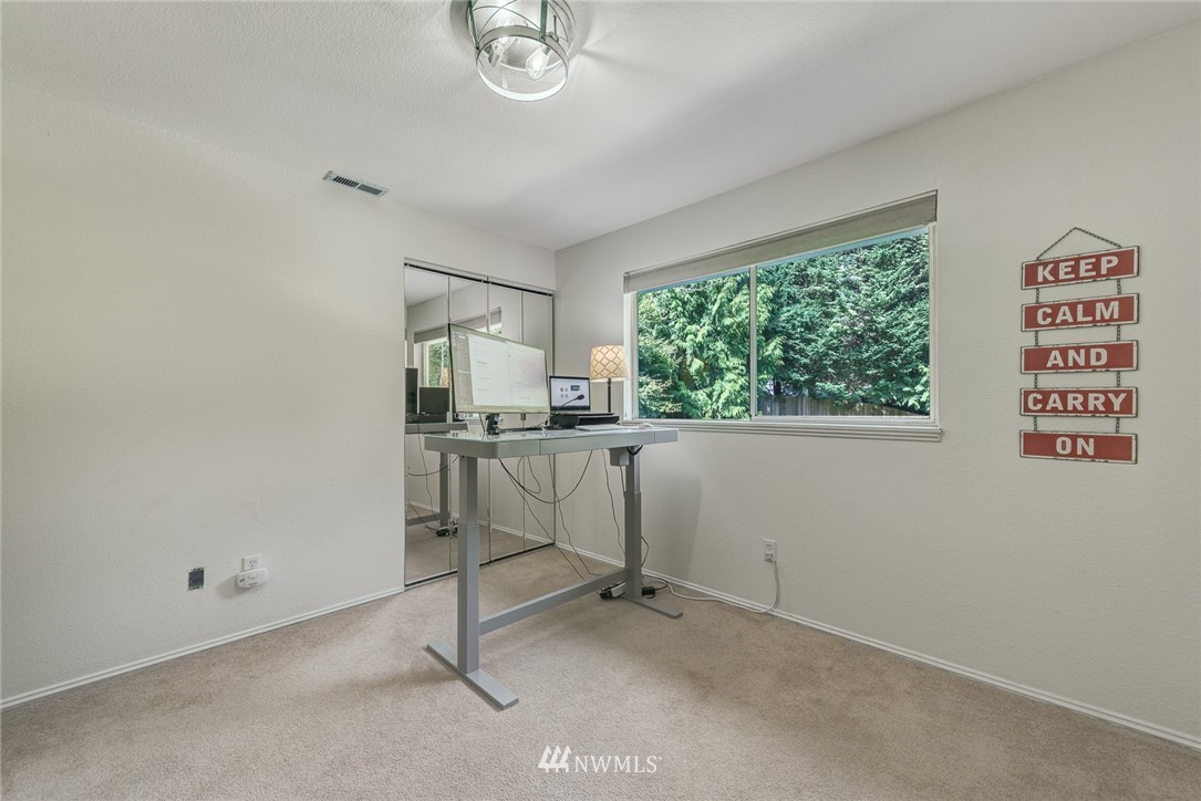 2633 189th Street Southeast Bothell, WA 98012 - Photo 22 of 35 a view of a workspace with furniture and a window