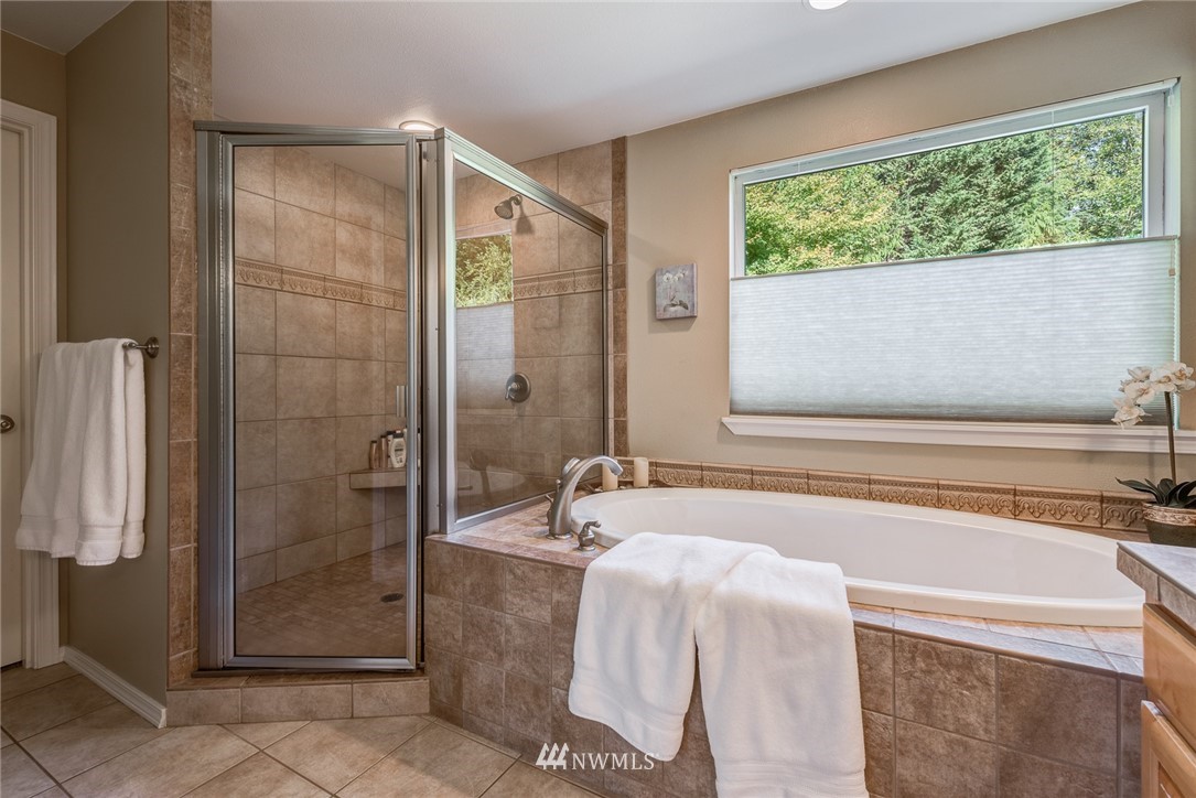 2633 189th Street Southeast Bothell, WA 98012 - Photo 27 of 35 a bathroom with a tub and a shower