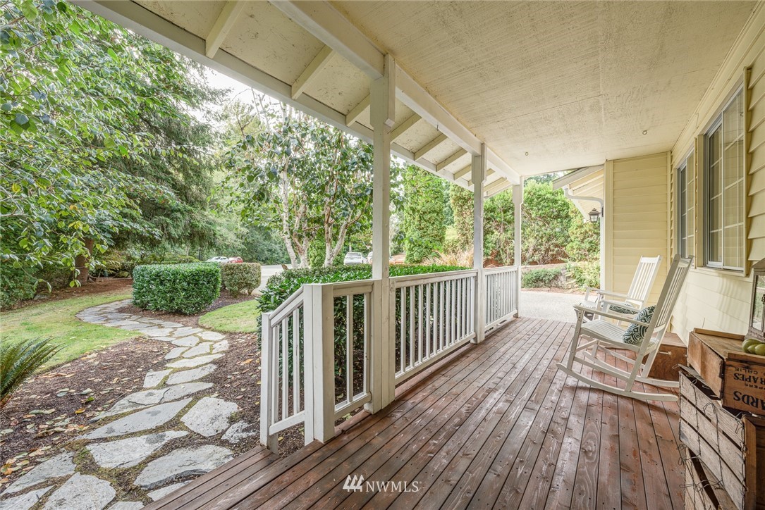 2633 189th Street Southeast Bothell, WA 98012 - Photo 4 of 35 a view of a porch with wooden floor and furniture