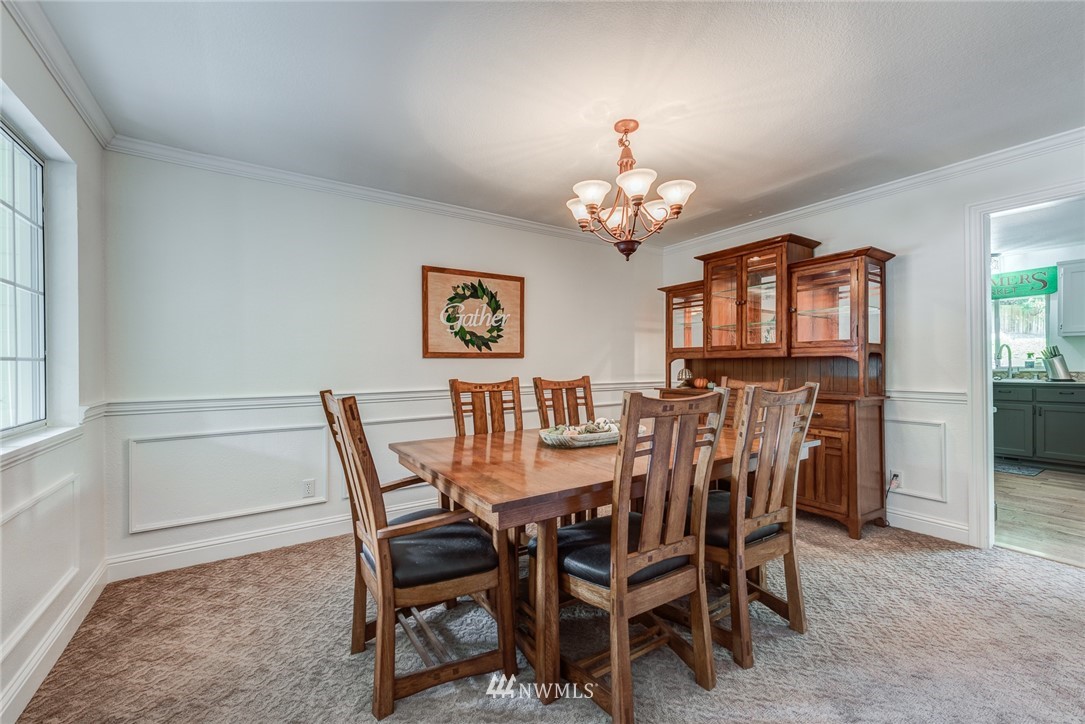2633 189th Street Southeast Bothell, WA 98012 - Photo 8 of 35 a view of a dining room with furniture and chandelier