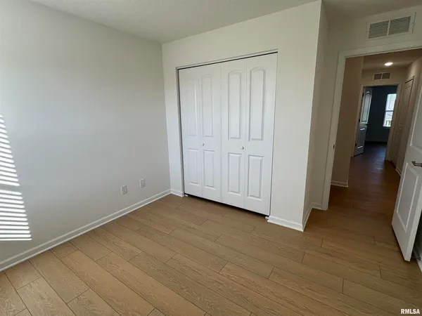 a view of a livingroom with wooden floor