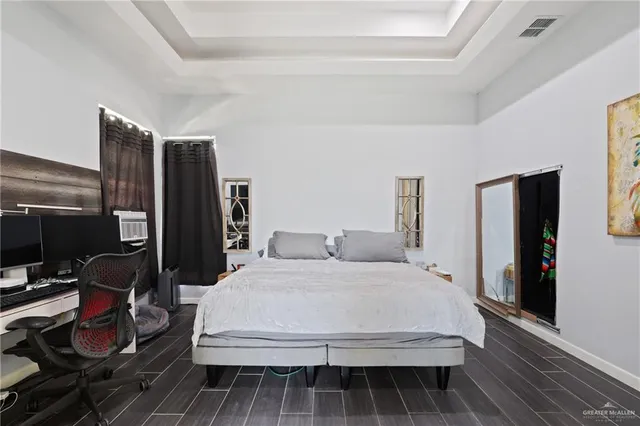 a large white bed in a white room