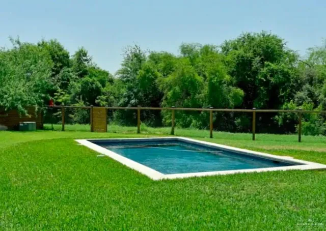 an aerial view of house with yard