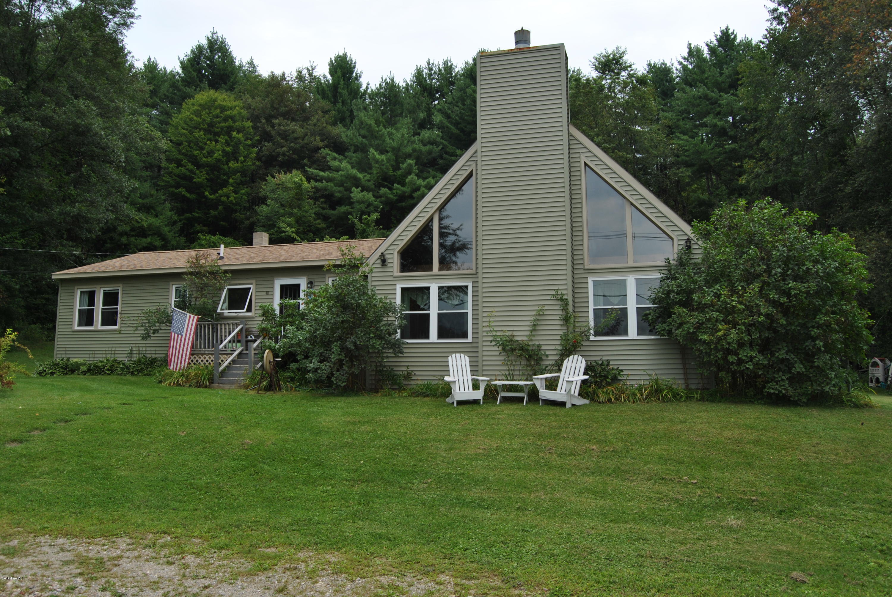 48 Alum Hill Road New Marlborough, MA 01259 - Photo 1 of 19 a view of a house with a yard and sitting area