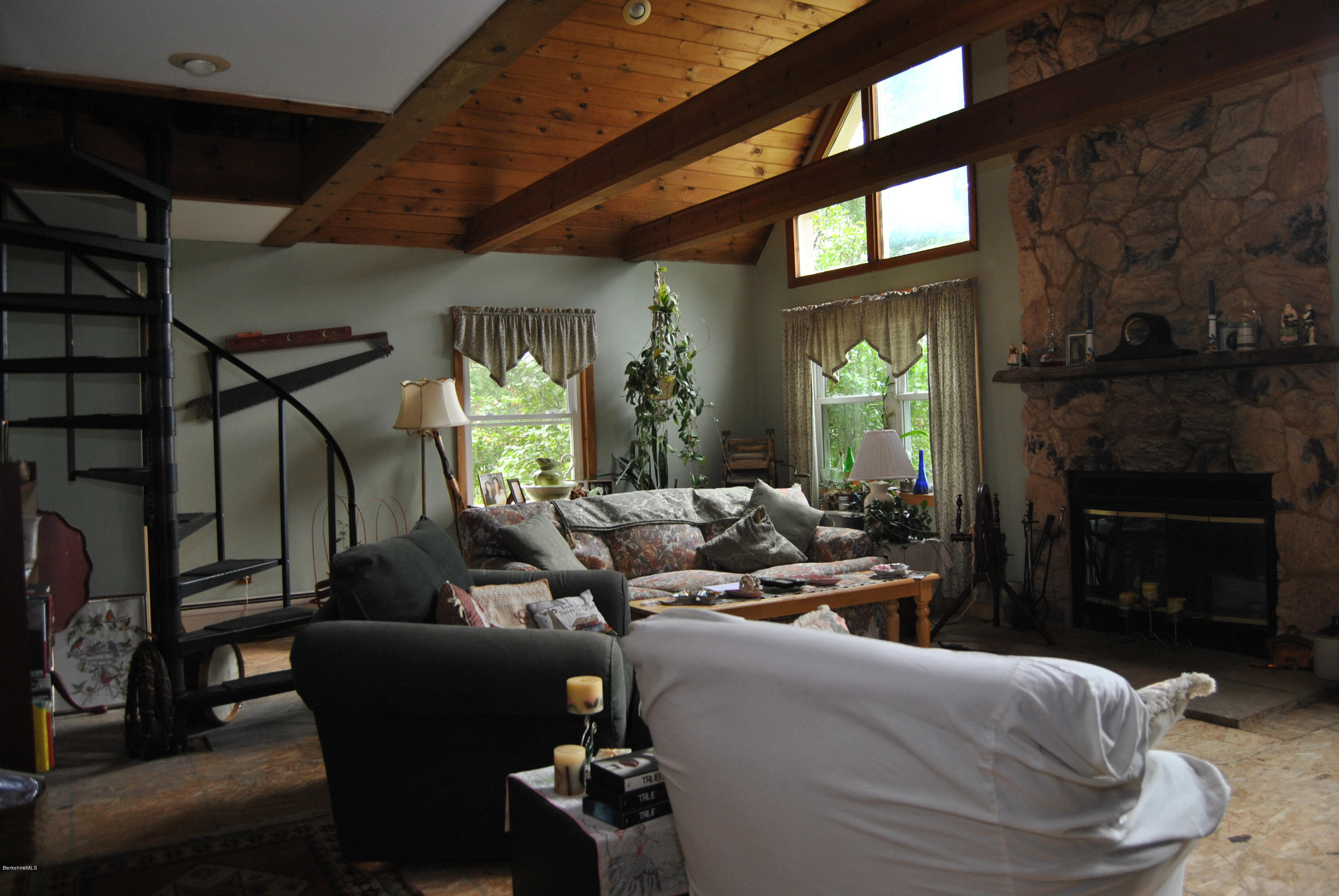 48 Alum Hill Road New Marlborough, MA 01259 - Photo 15 of 19 a living room with furniture and a fireplace