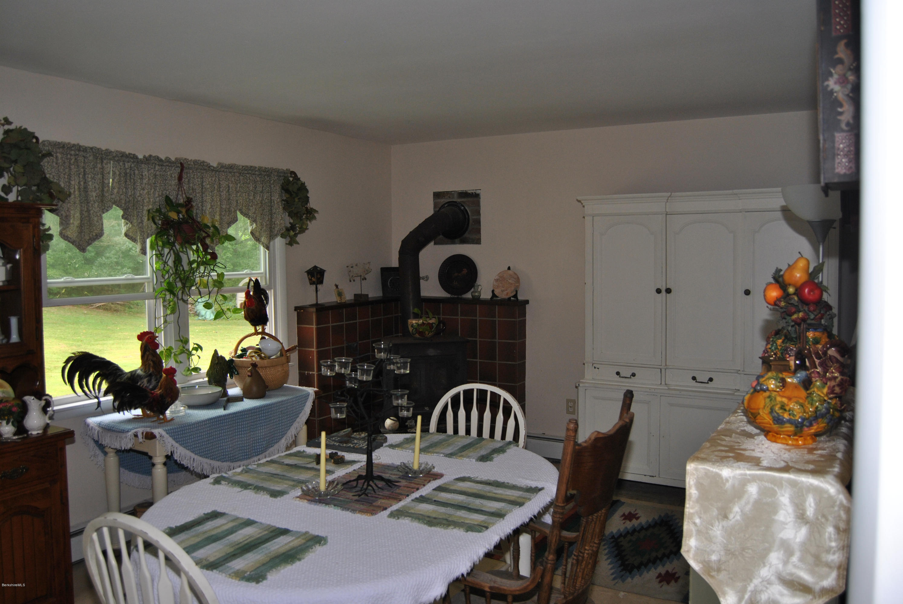 48 Alum Hill Road New Marlborough, MA 01259 - Photo 3 of 19 a balcony with dining table and chairs