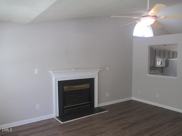 5409 Botany Bay Drive Raleigh, NC 27616 - Photo 2 of 14 a room with a fireplace and wooden floor